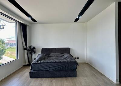 Minimalist modern bedroom with large window