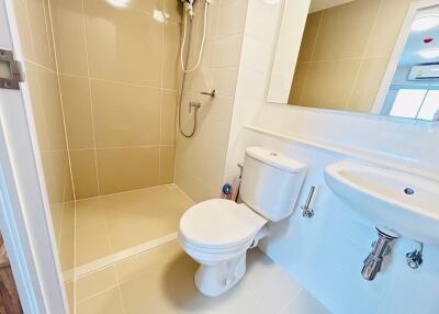 Modern bathroom with walk-in shower and white fixtures