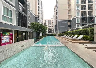 Outdoor common area with swimming pool in residential complex