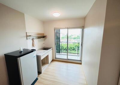 Compact kitchen area with large window