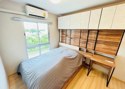 Modern bedroom with wooden furniture and natural light