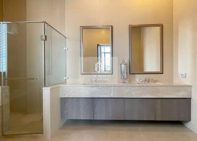 Modern bathroom with large mirrors and glass shower