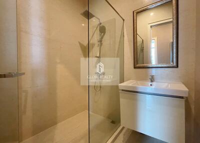 Modern bathroom with glass shower door and sleek vanity