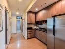 Modern kitchen with wooden cabinets and stainless steel appliances