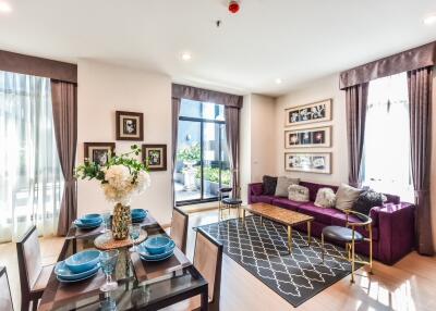 Modern living room with dining area and large windows