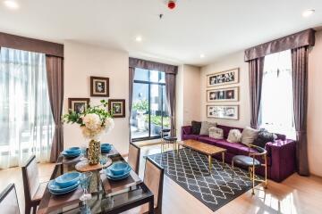 Modern living room with dining area and large windows