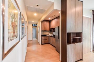 Modern kitchen with wooden cabinets and stainless steel appliances