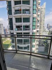 Balcony with city view and neighboring building