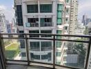 Balcony with city view and neighboring building