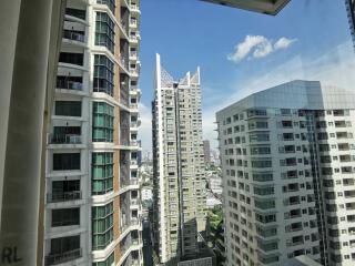 View from window showing nearby high-rise buildings