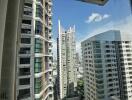 View from window showing nearby high-rise buildings