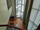 Spacious living room with floor-to-ceiling windows and city view