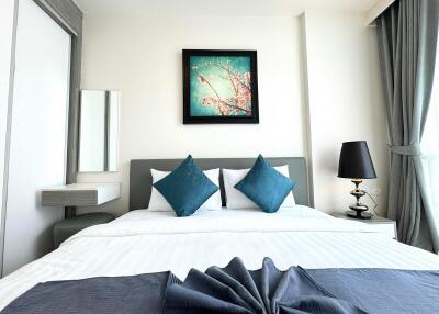 Modern bedroom with contemporary decor and vibrant artwork