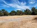 Spacious open yard with clear skies