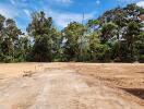 Spacious empty lot with surrounding trees