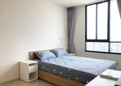 Modern bedroom with large windows and double bed