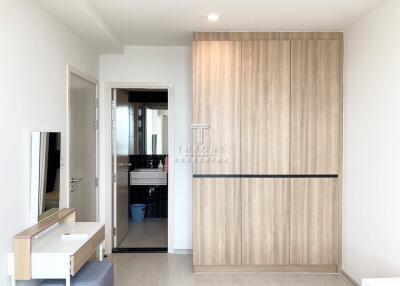 Modern bedroom with large wooden wardrobe