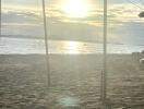 Sunset view of a beach from under a roofed structure