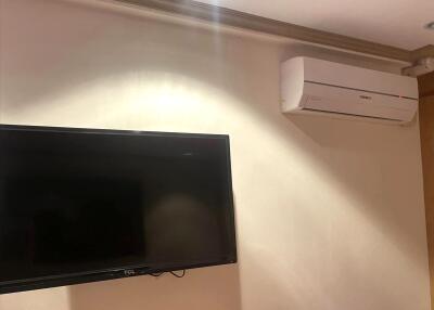 Wall-mounted television and air conditioning unit