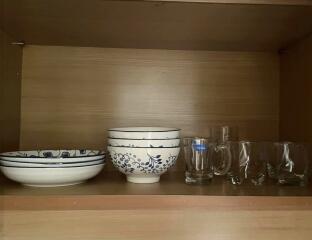 Kitchen shelf with dishes and glasses