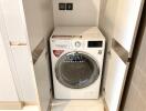 Laundry area with a 2-in-1 washing machine and dryer