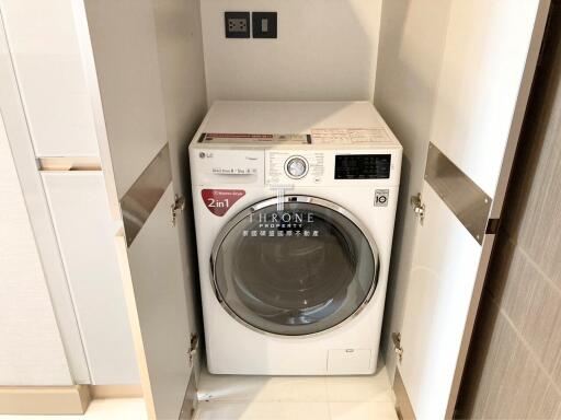 Laundry area with a 2-in-1 washing machine and dryer