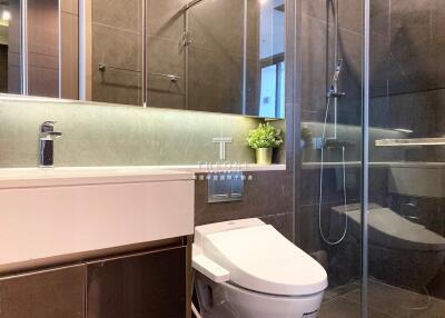 Modern bathroom with glass shower and toilet