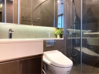 Modern bathroom with glass shower and toilet