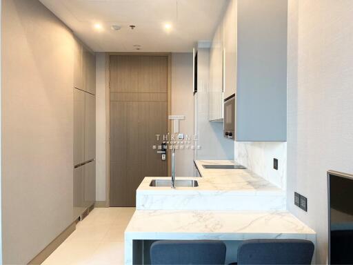 Modern kitchen with minimalist design and integrated appliances