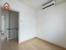 Minimalist white bedroom with air conditioner