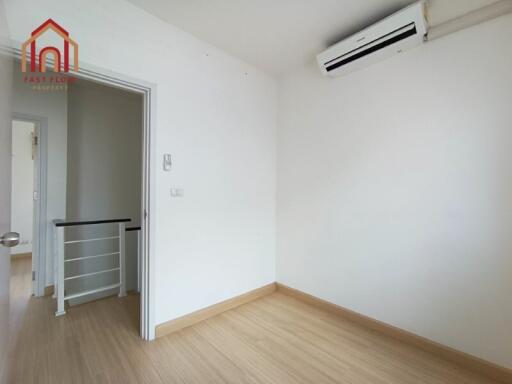 Minimalist white bedroom with air conditioner