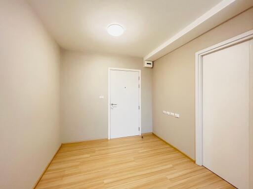 Bright entrance area with wooden flooring