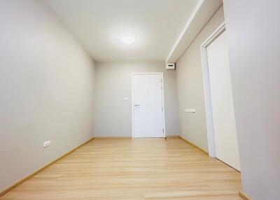 Spacious empty living room with wooden flooring