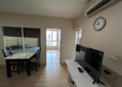 Living room with dining table and TV