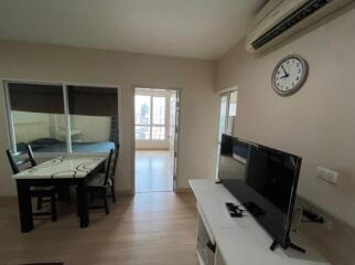 Living room with dining table and TV