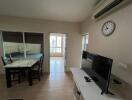 Living room with dining table and TV