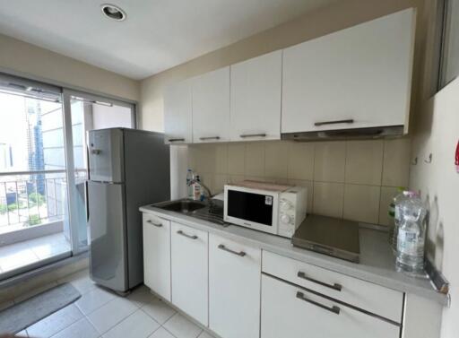 Modern kitchen with white cabinets and appliances