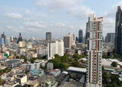 City skyline with various buildings and high-rises