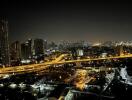 Night cityscape view from building balcony