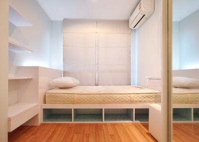 Small modern bedroom with a single bed