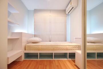 Small modern bedroom with a single bed