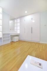 Modern bedroom with built-in wardrobe and vanity table