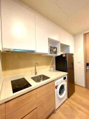 Modern kitchen with appliances and wooden cabinets