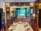 Elegant dining area with a view of the living space and outdoor garden