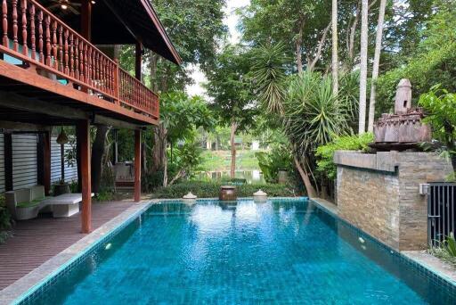 Beautiful outdoor area with pool and greenery