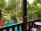 View of a backyard with pool and garden from a balcony