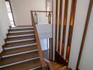 Modern staircase with wooden steps and decorative lighting