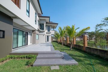 Exterior view of a modern house with a well-maintained yard