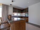 Modern kitchen with island and wooden cabinets