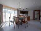 Modern open-plan kitchen and dining area with natural light